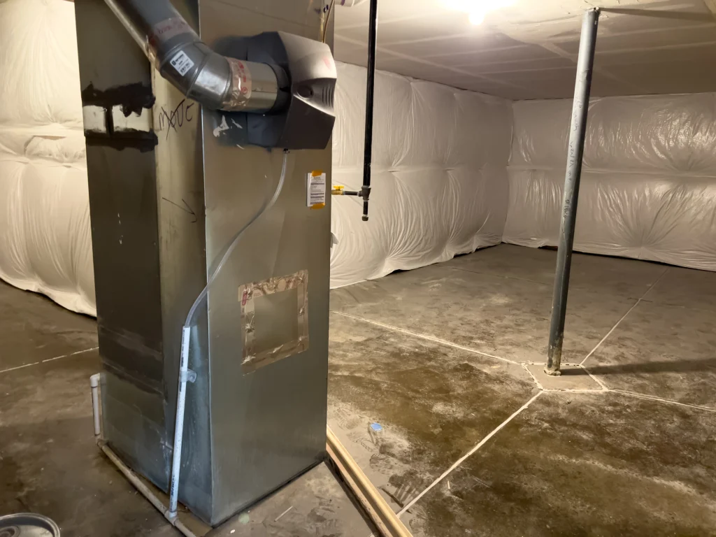 Technician evaluating furnace sizing requirements in an Edmonton home